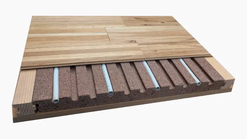 Schnittdarstellung der Lithotherm Fußbodenheizung Schnittzeichnung der Lithotherm Fußbodenheizung mit Natursteinformplatte, eingelegtem Heizrohr und direktem Bodenbelag – ideal für die Modernisierung durch geringe Aufbauhöhe und schnelle Reaktionszeit